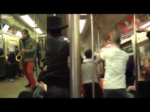 Two Total Strangers Have Saxophone Battle On NYC Subway Train